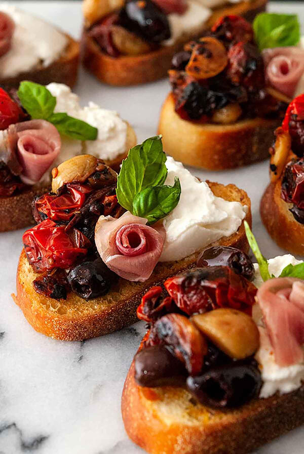 Bruschetta with Prosciutto, Burrata, Seared Tomatoes, & Roasted Garlic Bruschetta with Prosciutto, Burrata, Seared Tomatoes, & Roasted Garlic