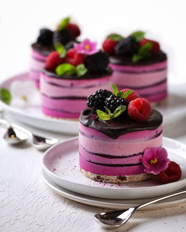 Blueberry cheesecake with chocolate sauce and summer berries Blueberry cheesecake with chocolate sauce and summer berries